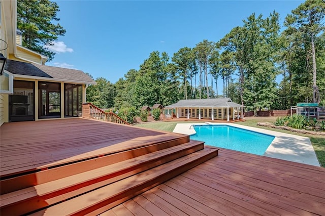 view of swimming pool with a wooden deck