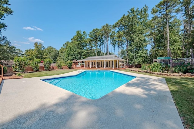 view of pool featuring a patio