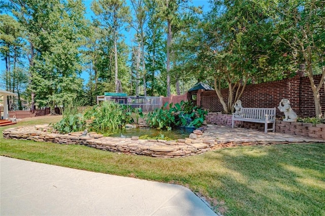 view of yard featuring a patio and a water view