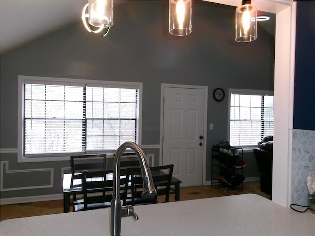 dining area with vaulted ceiling