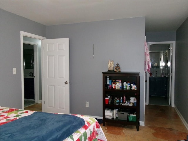 bedroom featuring baseboards