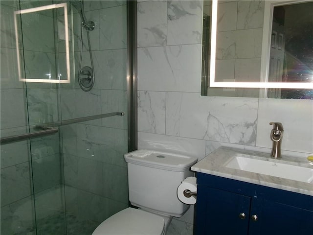 full bath featuring toilet, a shower stall, and vanity