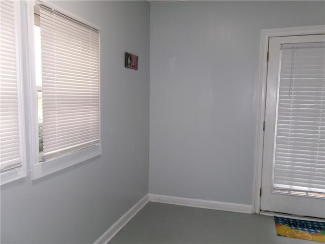 spare room featuring baseboards