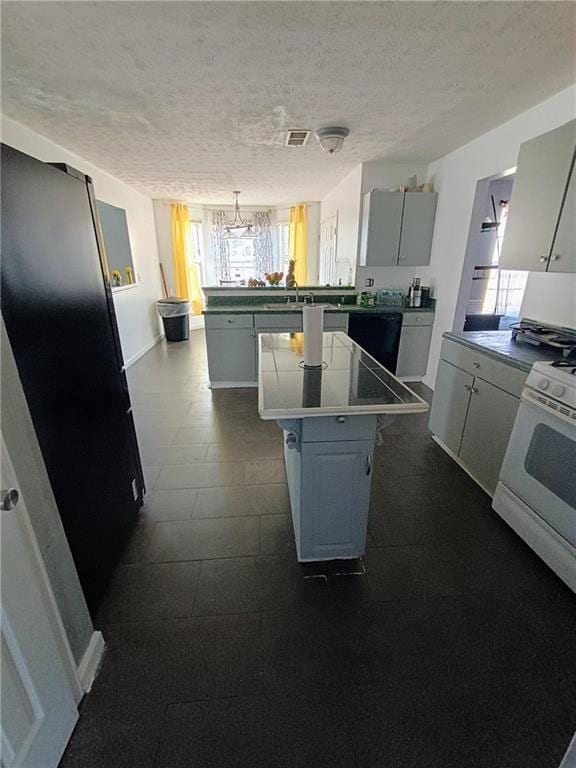 kitchen with a breakfast bar, a textured ceiling, dishwasher, a kitchen island, and white gas range oven