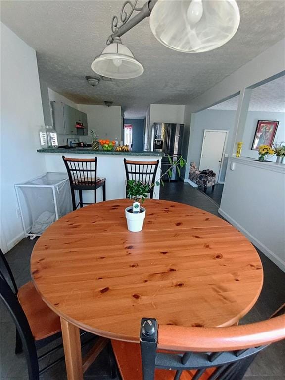 dining room with a textured ceiling