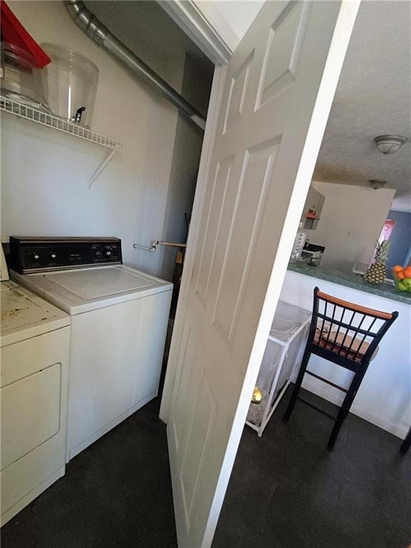 laundry room with washer and clothes dryer