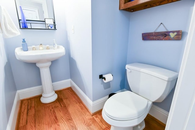 bathroom featuring toilet and hardwood / wood-style floors