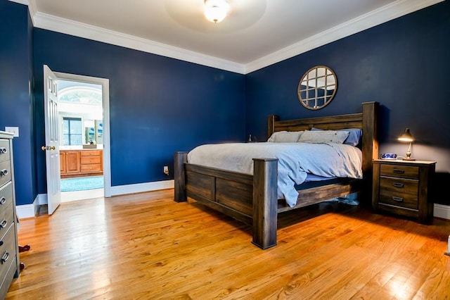 bedroom with ornamental molding, ensuite bath, and light hardwood / wood-style flooring