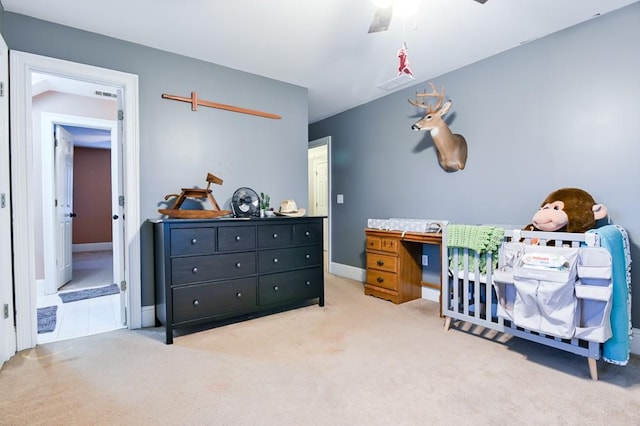 carpeted bedroom featuring ceiling fan