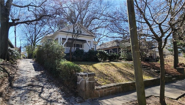 view of property exterior featuring covered porch