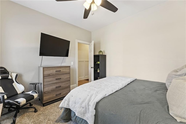 carpeted bedroom featuring a ceiling fan