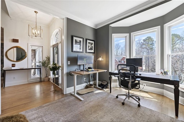 office featuring baseboards, wood finished floors, a chandelier, and crown molding