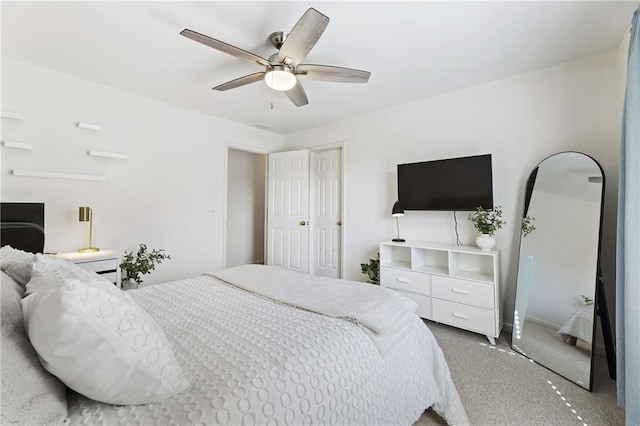 carpeted bedroom featuring a ceiling fan