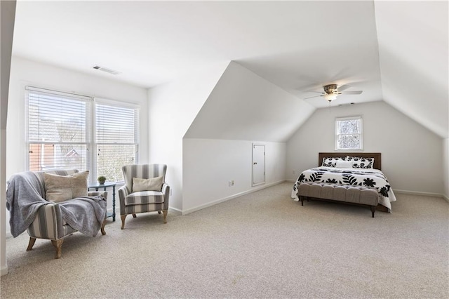 bedroom featuring visible vents, a ceiling fan, carpet, baseboards, and vaulted ceiling