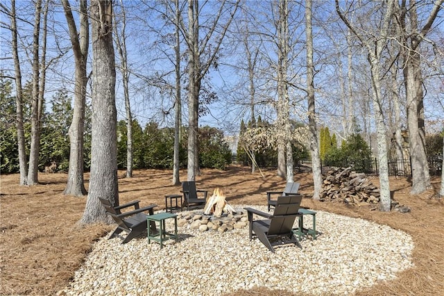 view of yard with a fire pit