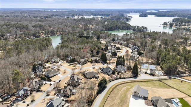 aerial view with a view of trees and a water view