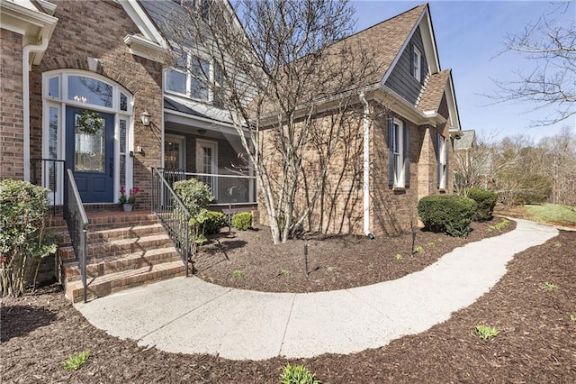 view of front of home featuring brick siding