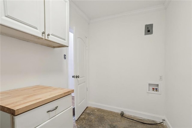 laundry area featuring cabinet space, baseboards, ornamental molding, and washer hookup