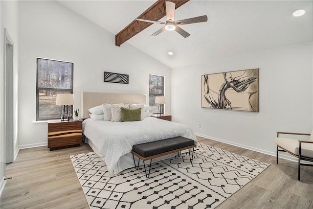 bedroom featuring vaulted ceiling with beams, light hardwood / wood-style floors, and ceiling fan