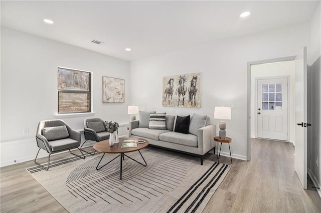 living room with light hardwood / wood-style floors