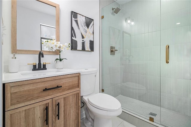 bathroom with vanity, toilet, and an enclosed shower