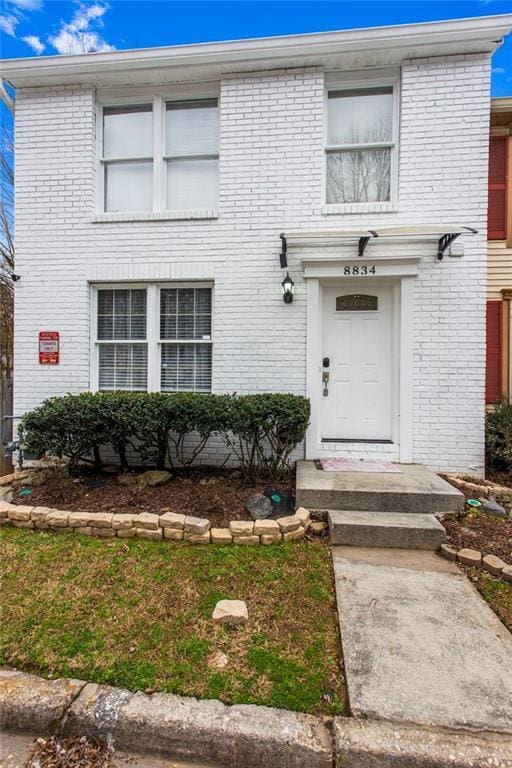 view of front of property featuring brick siding