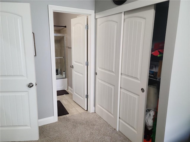 corridor featuring light tile floors