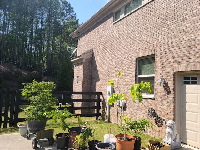 view of side of property with a patio