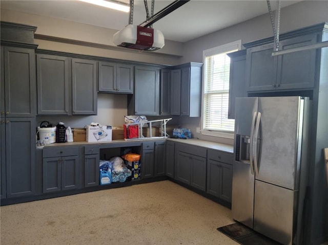 kitchen with stainless steel fridge with ice dispenser and gray cabinets