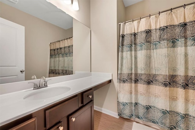 bathroom featuring vanity and hardwood / wood-style floors