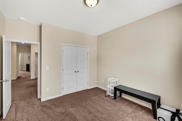 unfurnished bedroom with carpet floors and a closet