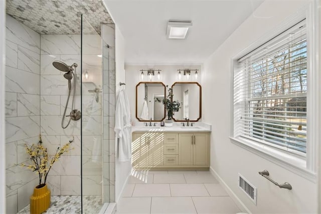 full bathroom with double vanity, visible vents, walk in shower, and a sink