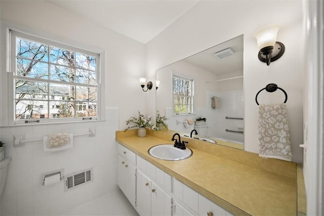 bathroom with plenty of natural light, vanity, and visible vents