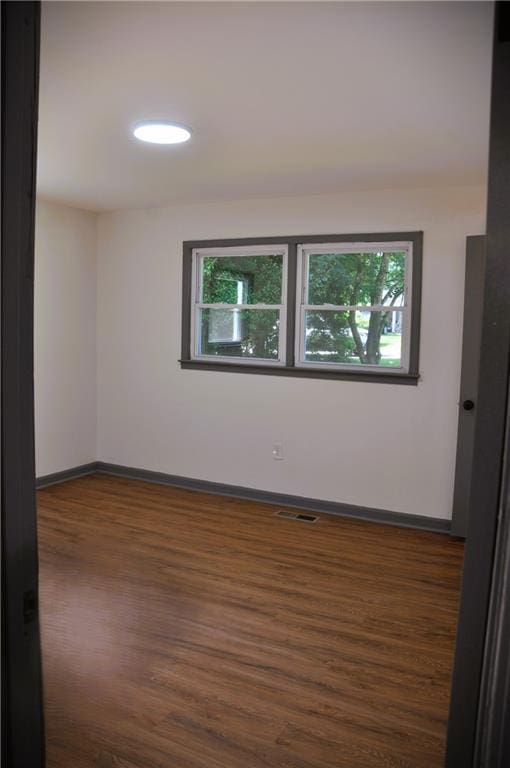 136 Rosewood Dr, Dallas, GA 30132 - unfurnished room with wood finished floors and healthy amount of natural light