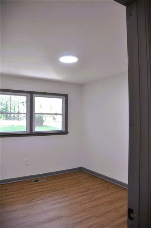136 Rosewood Dr, Dallas, GA 30132 - empty room with dark wood finished floors and baseboards