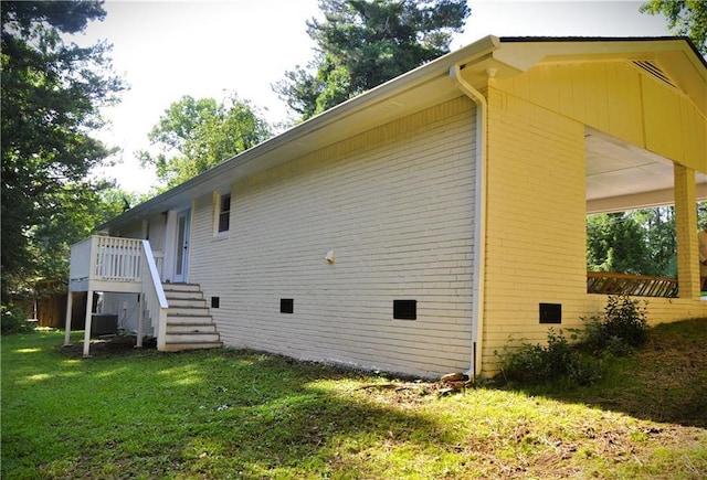 136 Rosewood Dr, Dallas, GA 30132 - view of side of home featuring a lawn, brick siding, and a deck