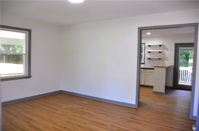 136 Rosewood Dr, Dallas, GA 30132 - spare room featuring wood finished floors and healthy amount of natural light