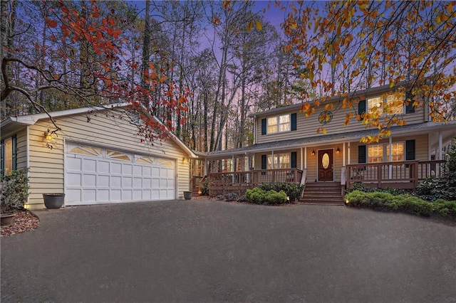 view of front of home featuring a garage and covered porch