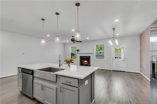 355 Niles Ct Unit 2, Marietta, GA 30060 - kitchen featuring gray cabinets, a lit fireplace, dishwasher, a sink, and recessed lighting