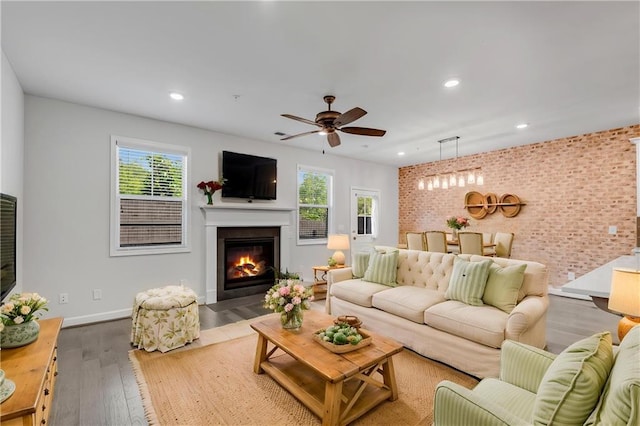 355 Niles Ct Unit 2, Marietta, GA 30060 - living room featuring a glass covered fireplace, ceiling fan, wood finished floors, and a wealth of natural light
