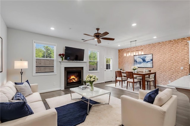 355 Niles Ct Unit 2, Marietta, GA 30060 - living area with a ceiling fan, brick wall, wood finished floors, a glass covered fireplace, and recessed lighting