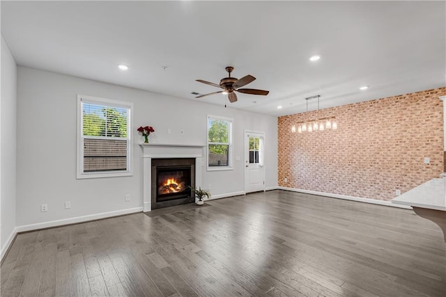 355 Niles Ct Unit 2, Marietta, GA 30060 - unfurnished living room with dark wood-type flooring, a fireplace with flush hearth, baseboards, and plenty of natural light