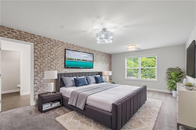 355 Niles Ct Unit 2, Marietta, GA 30060 - bedroom with baseboards, carpet, and brick wall