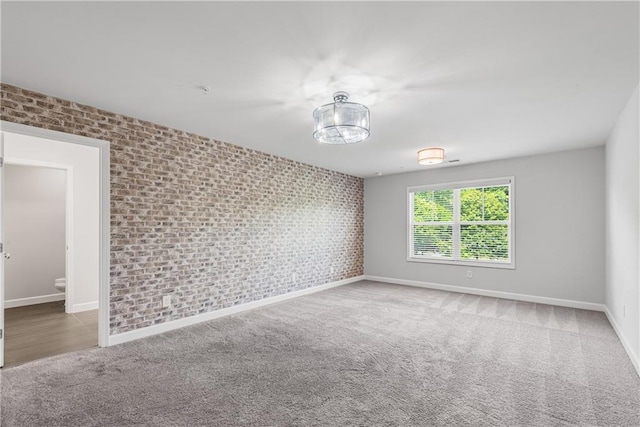 355 Niles Ct Unit 2, Marietta, GA 30060 - unfurnished room with carpet floors, baseboards, and brick wall