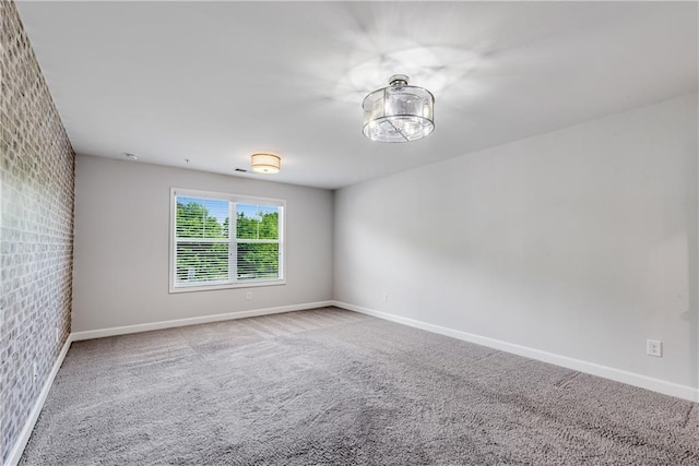 355 Niles Ct Unit 2, Marietta, GA 30060 - unfurnished room with baseboards, carpet, and brick wall