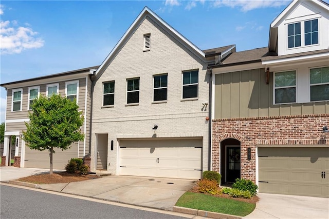 355 Niles Ct Unit 2, Marietta, GA 30060 - townhome / multi-family property with board and batten siding, brick siding, driveway, and a garage