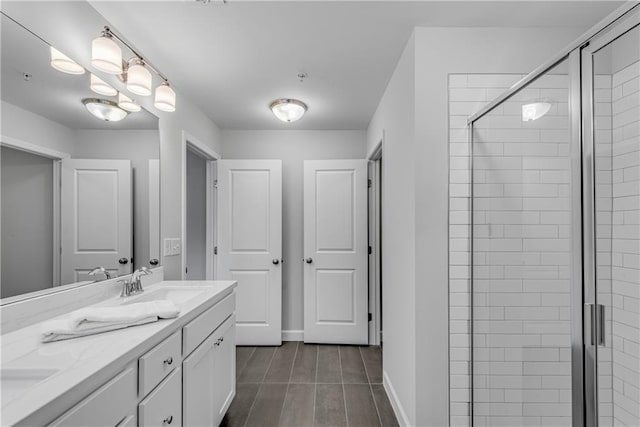355 Niles Ct Unit 2, Marietta, GA 30060 - bathroom with double vanity, wood finished floors, baseboards, a shower stall, and a sink