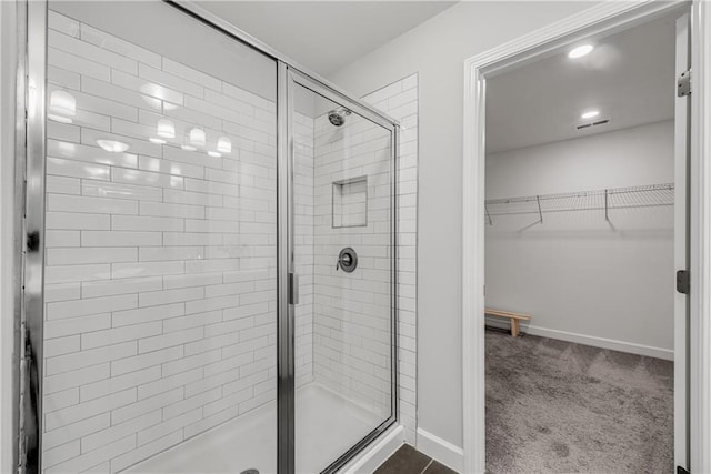 355 Niles Ct Unit 2, Marietta, GA 30060 - bathroom with baseboards, a spacious closet, a shower stall, and visible vents