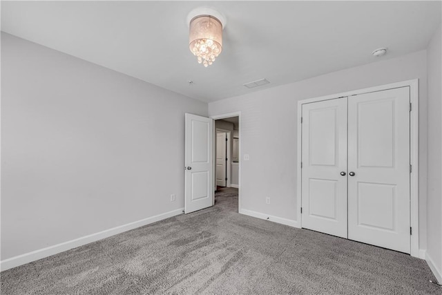 355 Niles Ct Unit 2, Marietta, GA 30060 - unfurnished bedroom featuring baseboards, carpet, and a closet