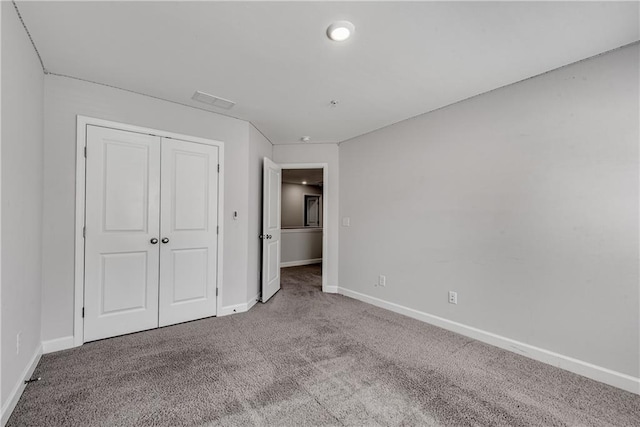 355 Niles Ct Unit 2, Marietta, GA 30060 - unfurnished bedroom featuring baseboards, carpet, visible vents, and a closet